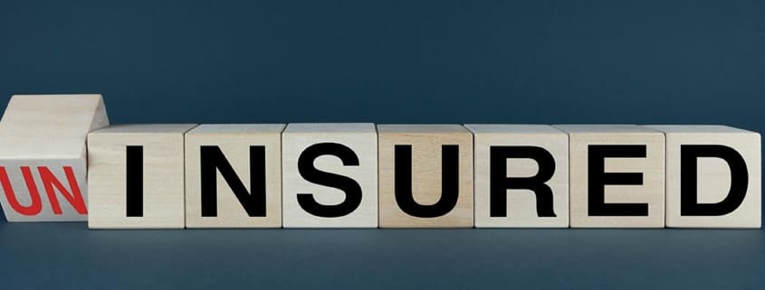 scrabble blocks that spell out un insured